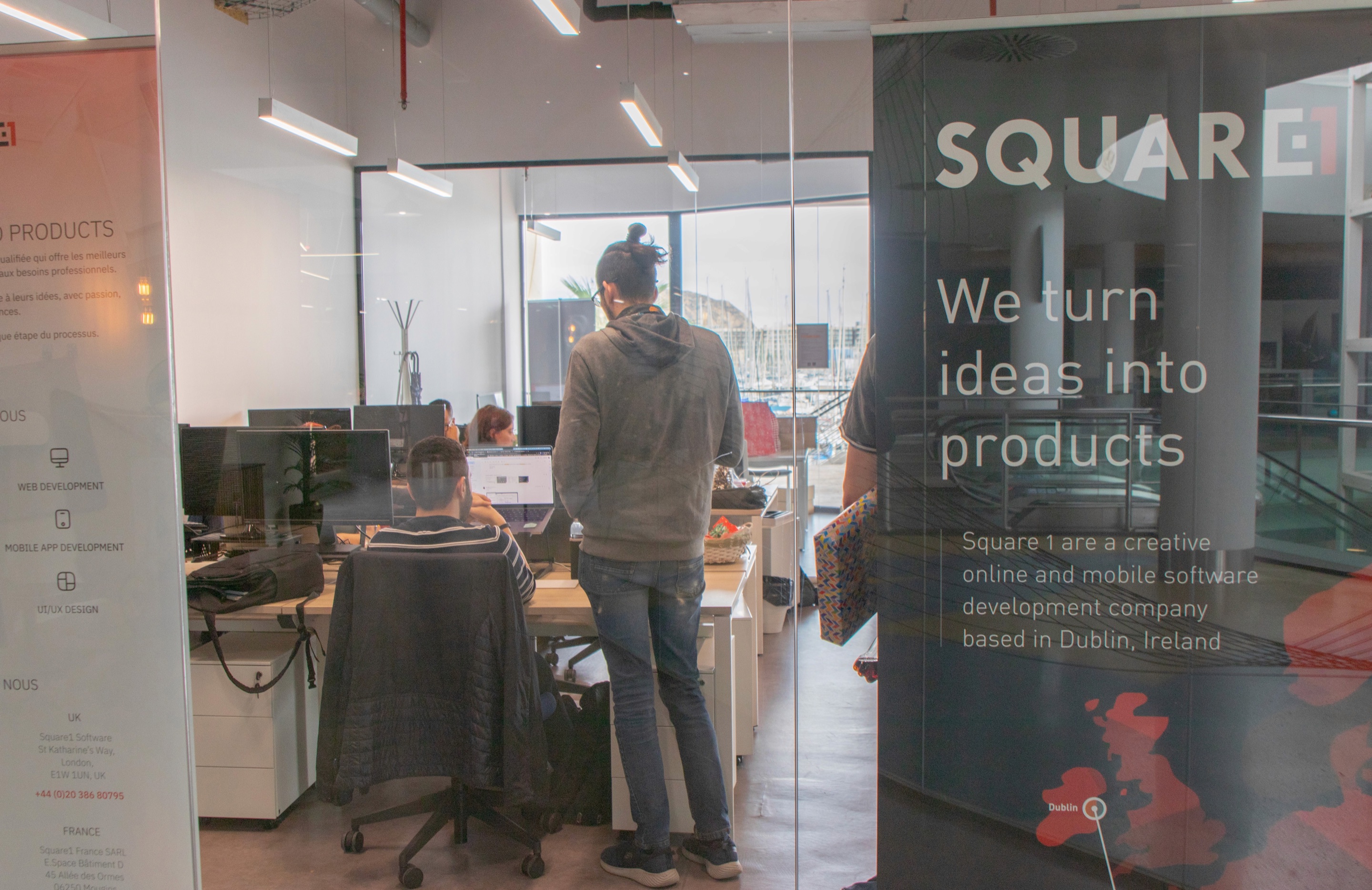 Office with a Square1 banner reading We turn ideas into products