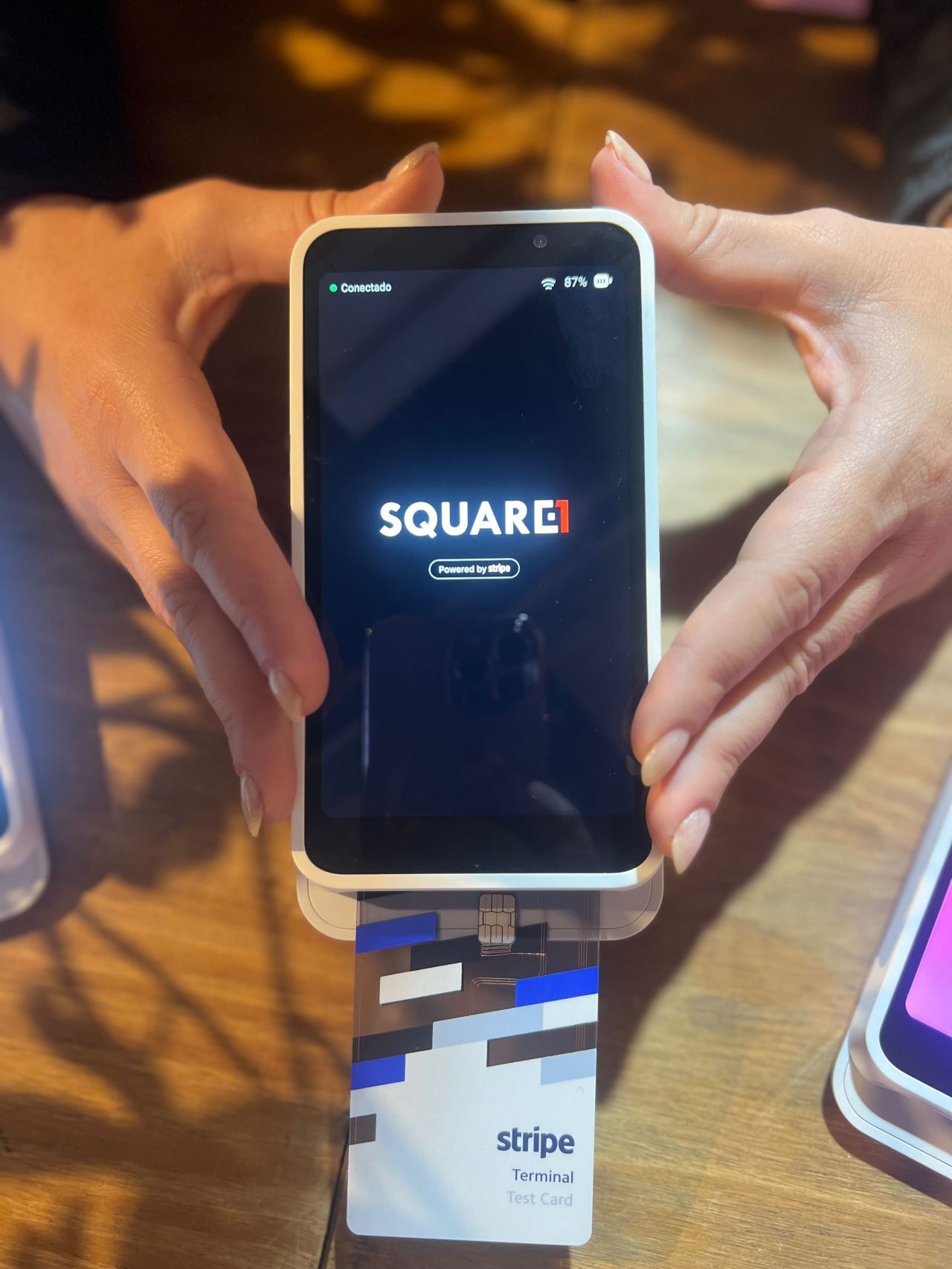 Stripe Terminal reader displaying the Square1 logo