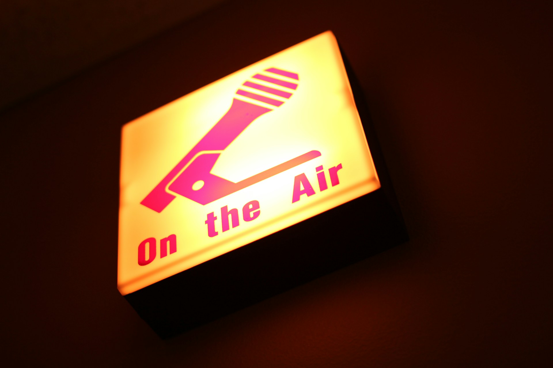 Lit On the Air sign with a microphone graphic