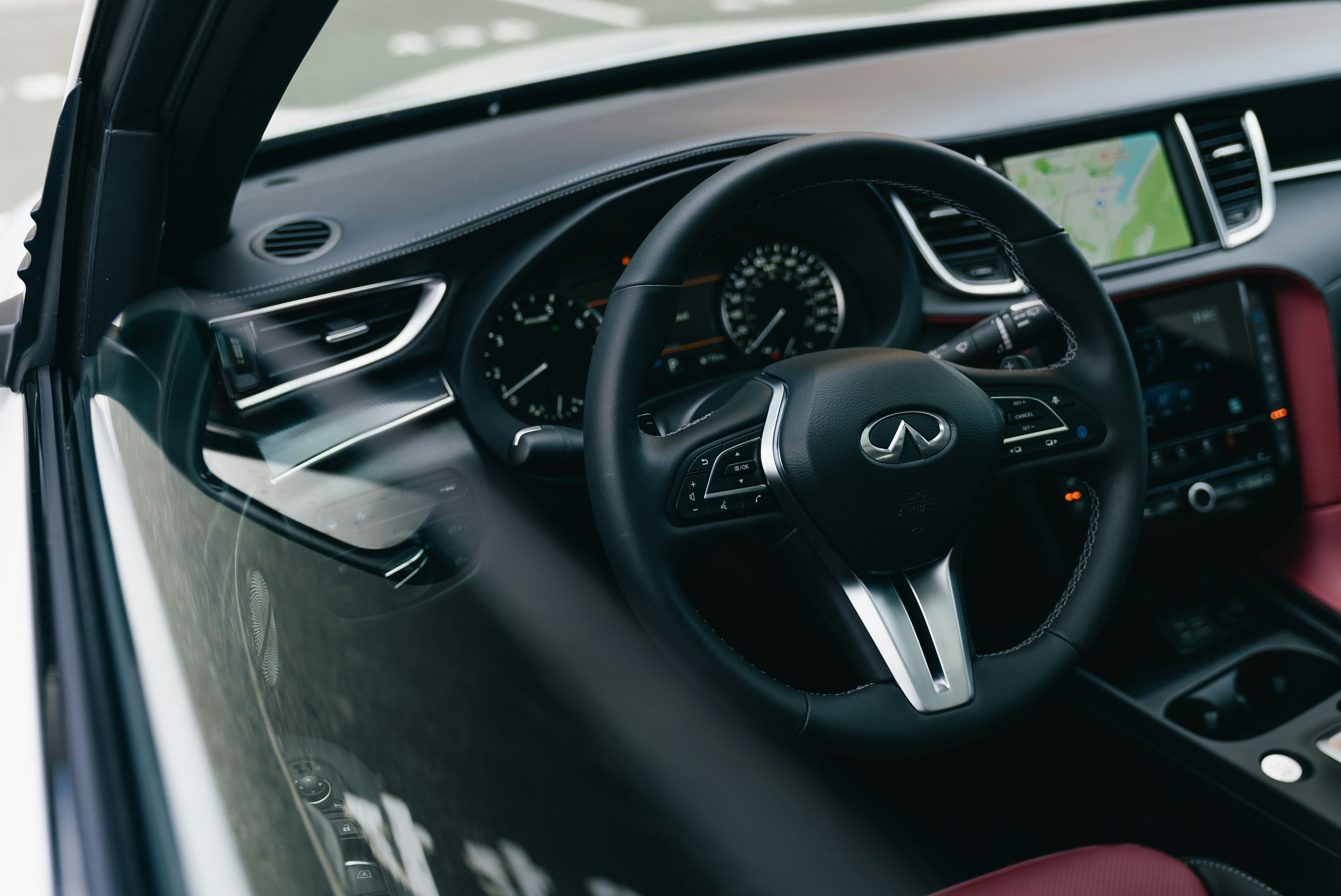 Steering wheel and navigation screen inside a modern car