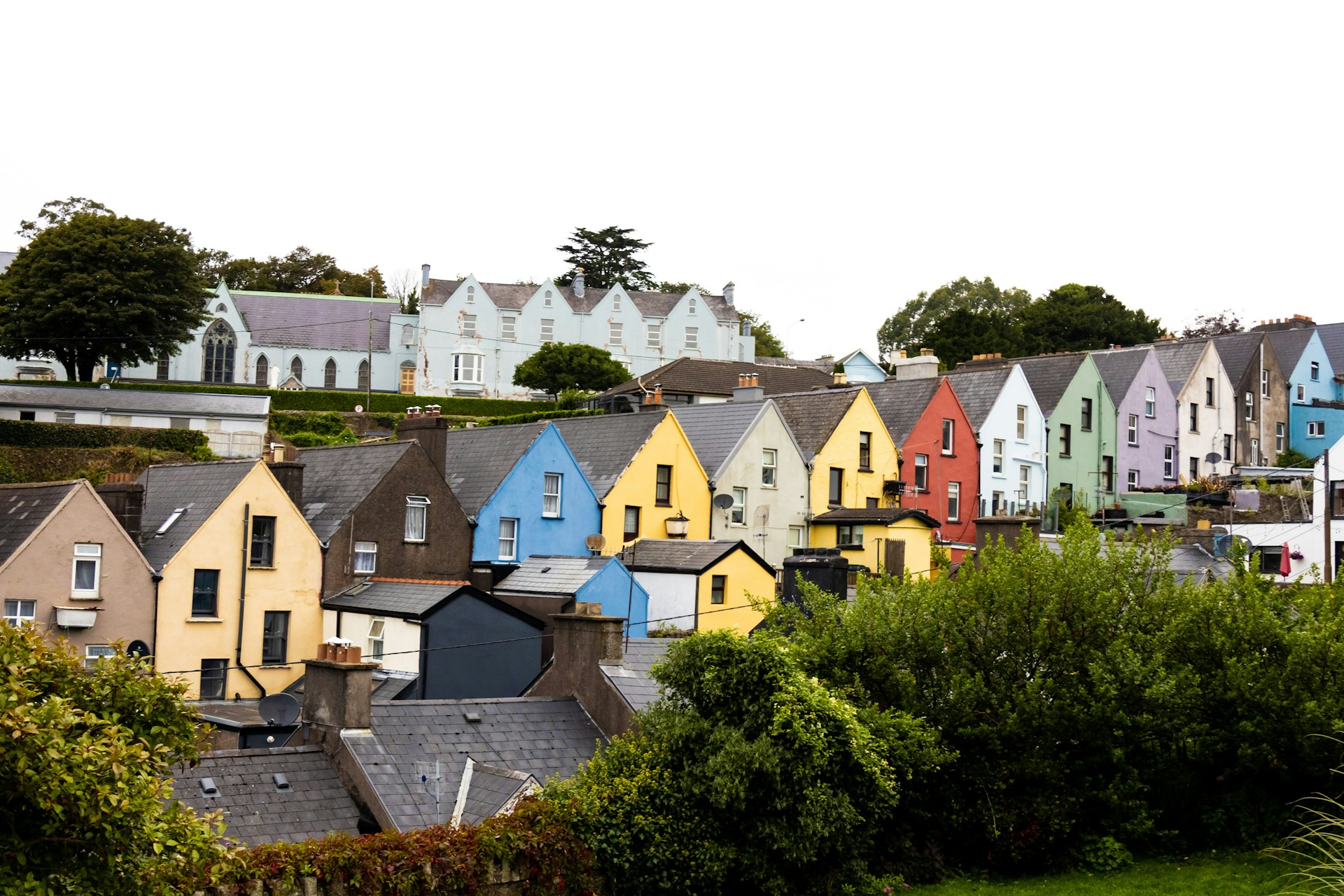 Row of brightly painted terraced houses on a hillside